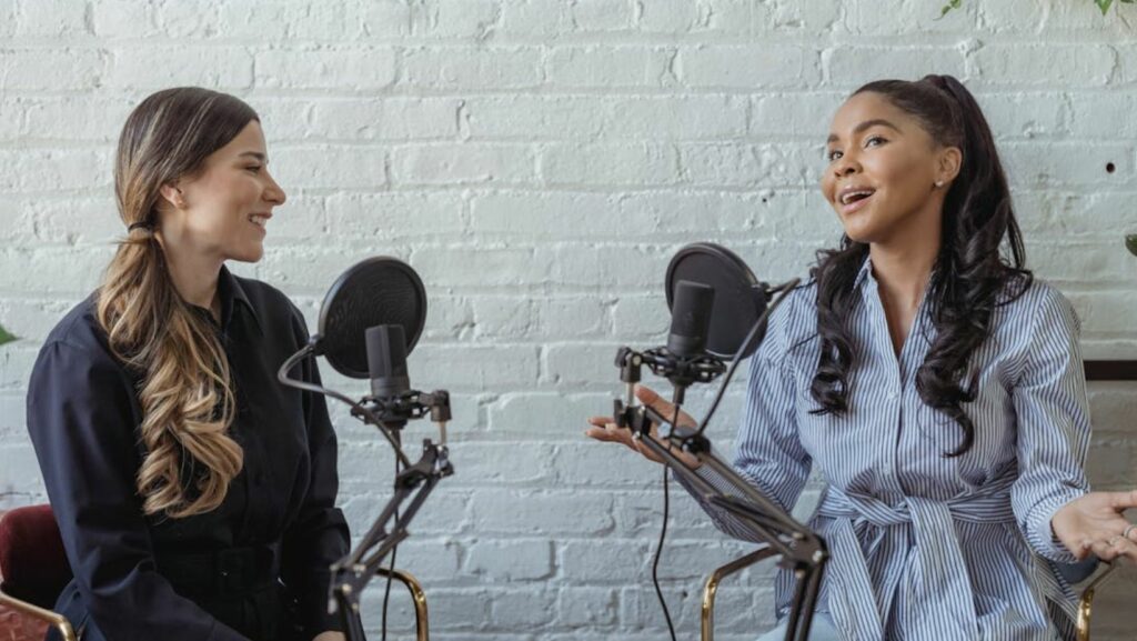 Positive woman talking to podcast host
